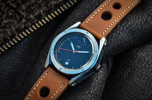 British watch- stainless steel case with black dial and tan leather rally strap